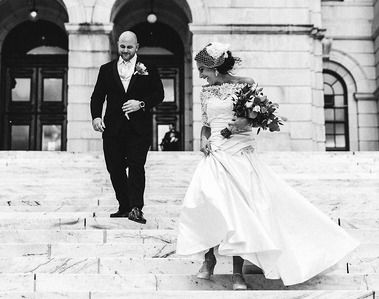 A newly wed couple on the steps of Rhode Island State House in black and white