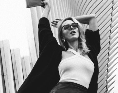 BW photo of a model posing in front of The Oculus in NYC. Photographer Ivan Djikaev/Mind On Photography.