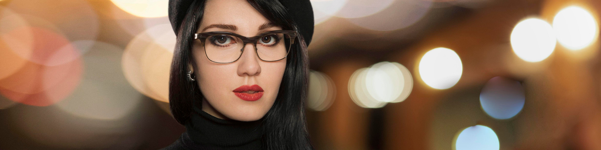 Glamorous headshot of a woman wearing glasses. Photography by Ivan Djikaev/Mind On Photography Boston
