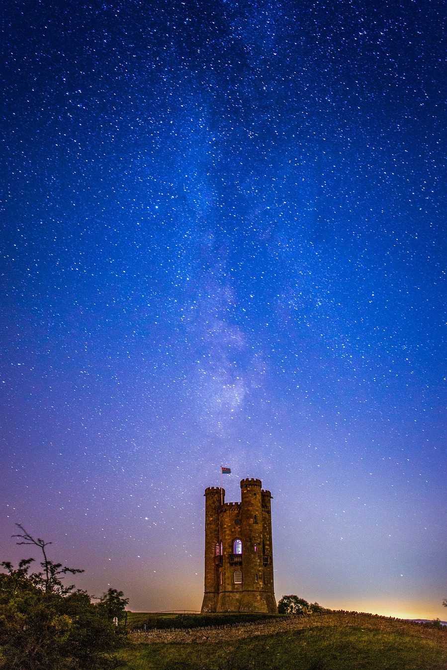 Broadway Tower at night with a dark starry sky back ground 