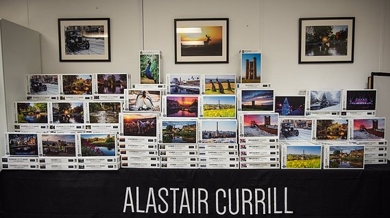 Table displaying range of jigsaw puzzles created by Alastair Currill Photography