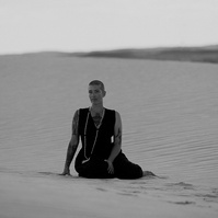 a buddhist monk photographed by Cari Faye Antonovich of The White Room Studios at the Seminoe sand dunes near Rawlins Wyoming at sunset. Dune vibes