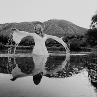 Ranch Reverie
From the studio, we transitioned to a friend’s ranch located off Hat Six Road, a setting that promised natural beauty and a golden-hour glow that only Wyoming can offer. The ranch was the perfect backdrop for Isis’s diverse wardrobe changes,