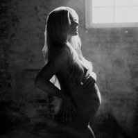 photograph of emmy Voigt of Casper Wyoming maternity portrait photographed by Cari Faye Antonovich of Cari Faye photography and the white room