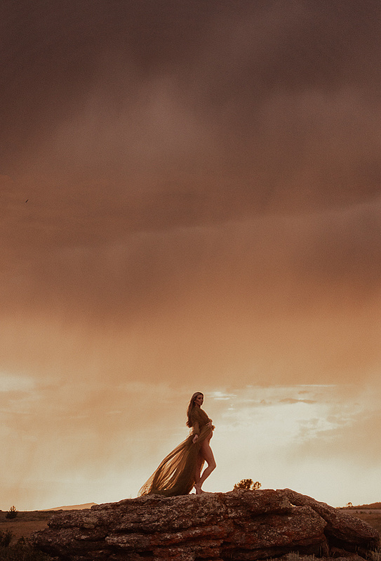 photograph of emmy Voigt of Casper Wyoming maternity portrait photographed by Cari Faye Antonovich of Cari Faye photography and the white room muddy mountain photoshoot sunset