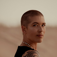 a buddhist monk photographed by Cari Faye Antonovich of The White Room Studios at the Seminoe sand dunes near Rawlins Wyoming at sunset