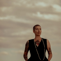 a buddhist monk photographed by Cari Faye Antonovich of The White Room Studios at the Seminoe sand dunes near Rawlins Wyoming at sunset