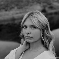 Ranch Reverie
From the studio, we transitioned to a friend’s ranch located off Hat Six Road, a setting that promised natural beauty and a golden-hour glow that only Wyoming can offer. The ranch was the perfect backdrop for Isis’s diverse wardrobe changes,