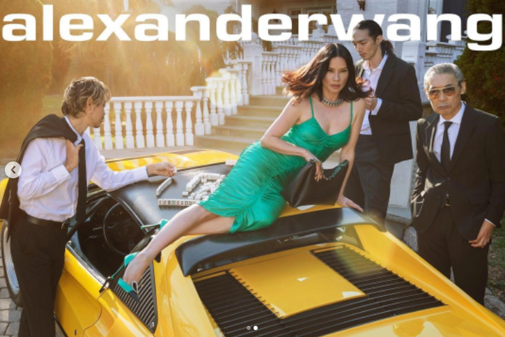 Lucy Liu wears Ruched Lycra cami dress in Alexander Wang Resort 22 campaign.