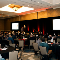 A large crowd fills a banquet hall at the Hilton, Vancouver for the 2025 annual conference for Associated General Contractors (AGC)