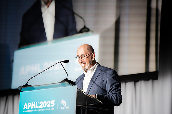 Executive giving a presentation at an APHL conference in Portland Oregon's Expo Center