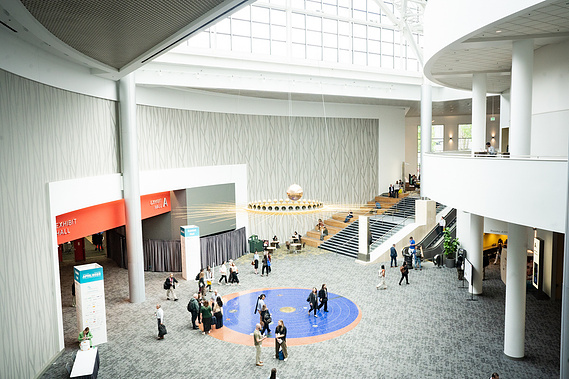 The brightly lit interior of Portland's Expo Center during a conference