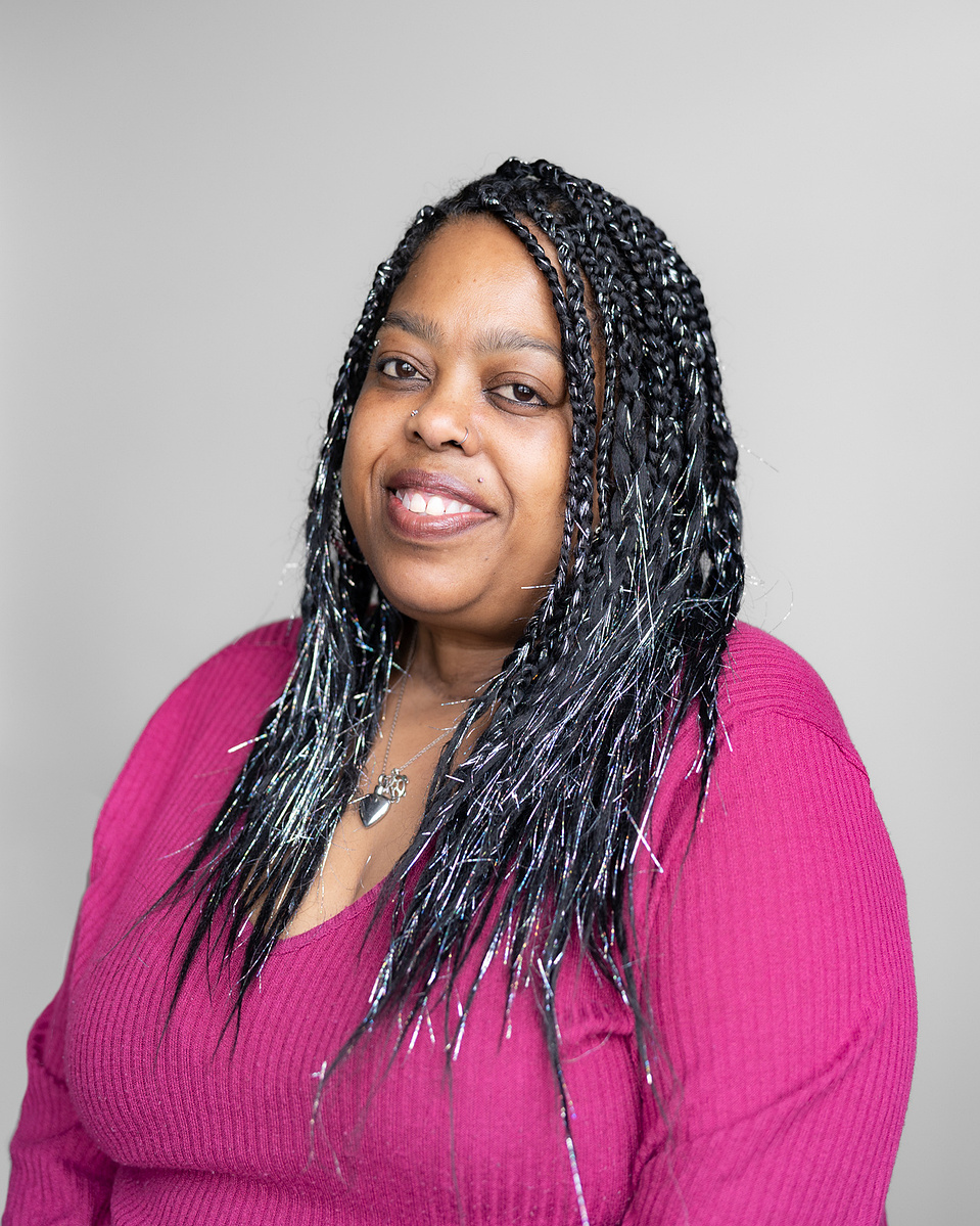 Headshot of a black woman smiling