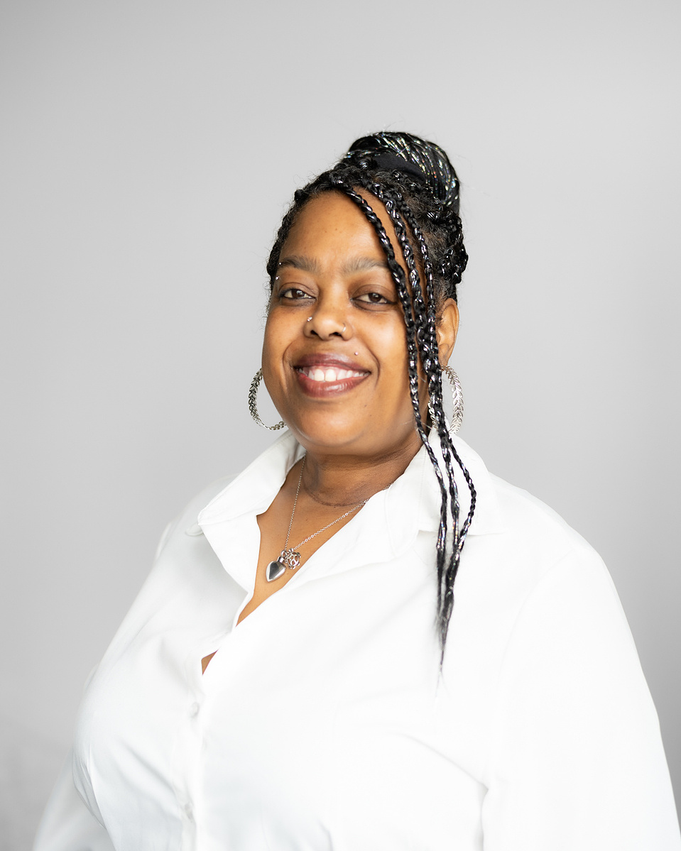 Headshot of a black woman smiling