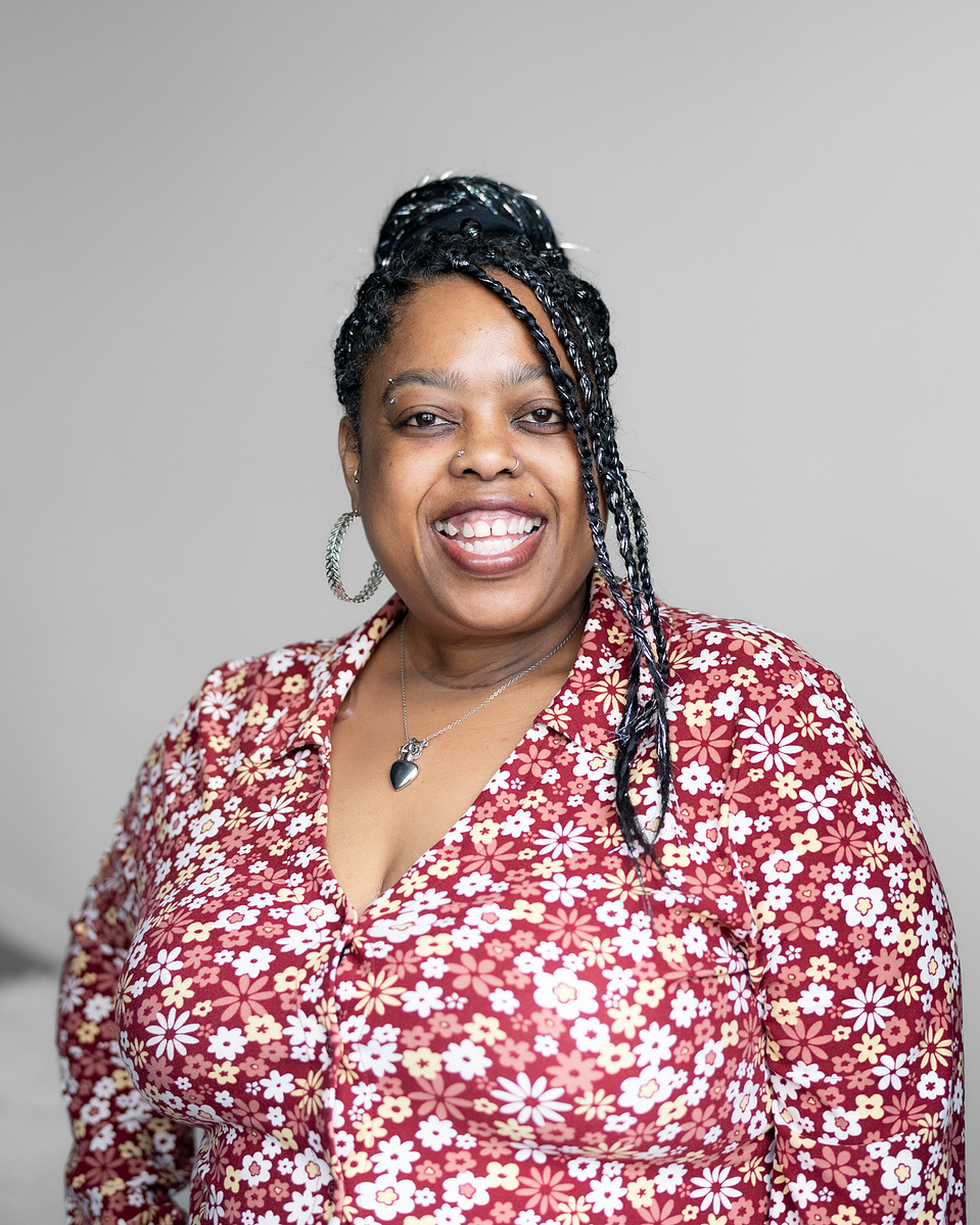 Headshot of a black woman smiling