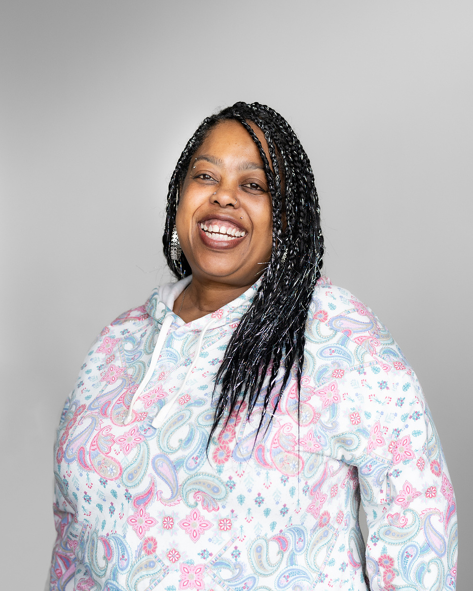 Headshot of a black woman smiling
