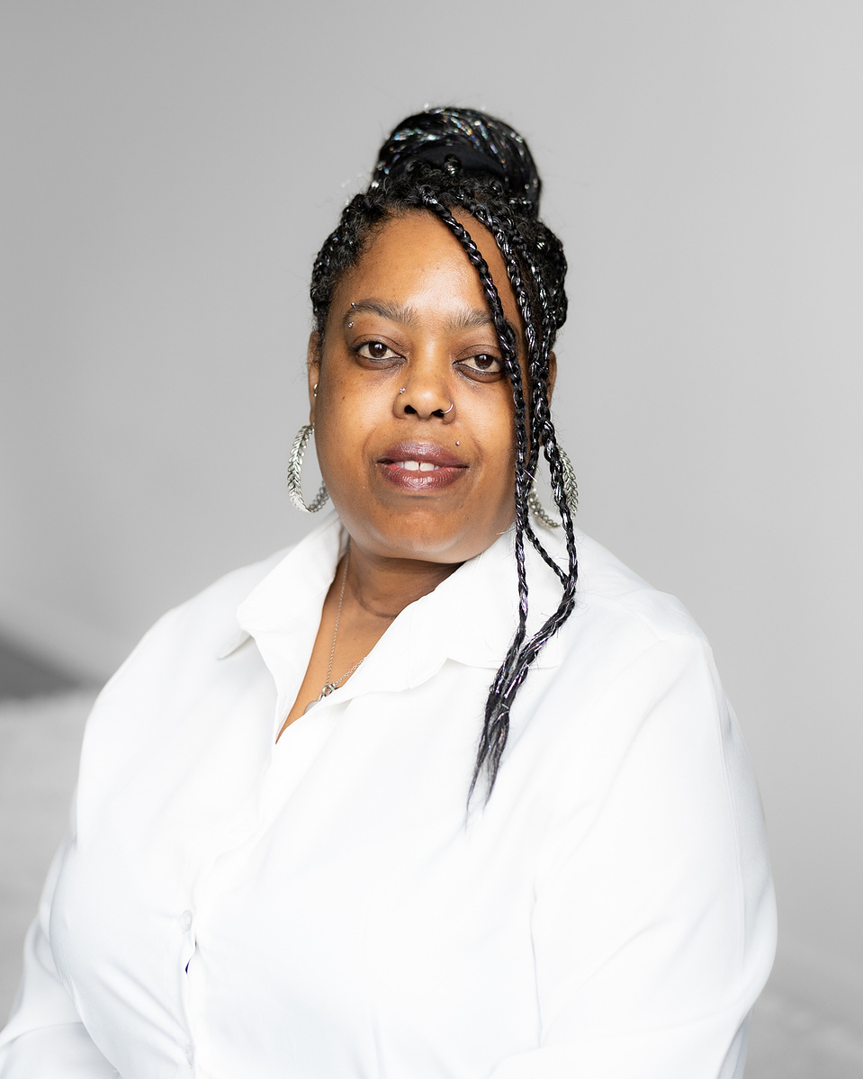 Headshot of black woman with a serious face