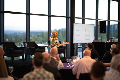 Laurie Baedke giving a talk on coaching at the 4th annual Physician Leadership Summit in Portland