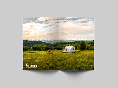 A magazine ad campaign for an outdoor camping company featuring a tent in a large field.