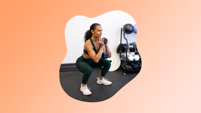 Dorian C. performing a dumbbell squat indoors.