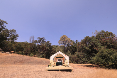 A canvas TENTRR tent in California, surrounded by blue sky.
