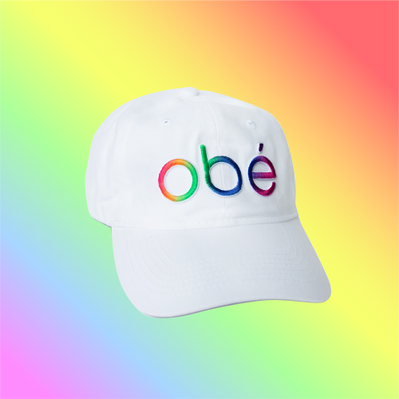 A rainbow obé logo on a white hat, sold as e-commerce during Pride month.