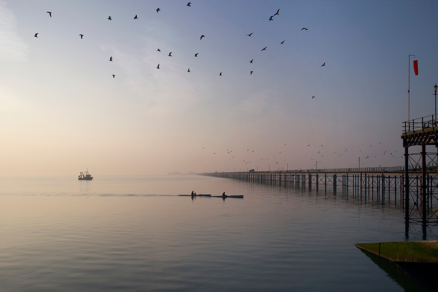 Kayaks at Southend pier, photographic print.