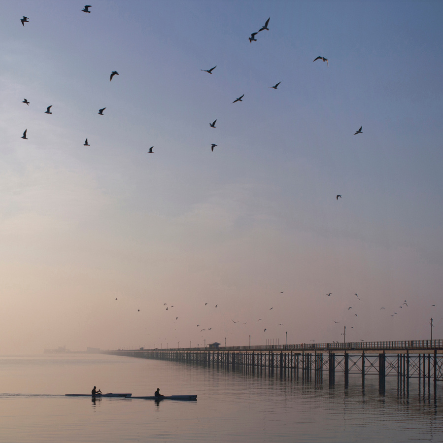 Kayaks at Southend pier, photographic print.