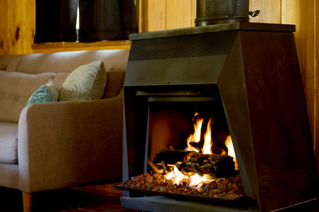 www.arrivedmedia.com, @arrivedmedia, cozy , Coco Cabina Cabin, Big Bear Lake, CA, Cozy Fireplace, woods, real estate photography, commercial photography, detail photo