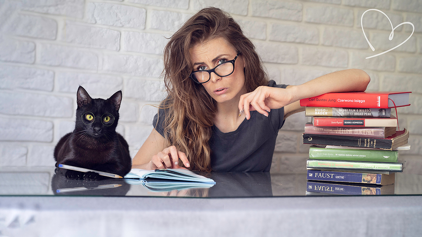 Ola and Fryderyk the cat posing for the thumbnail of their new book fundraiser. 