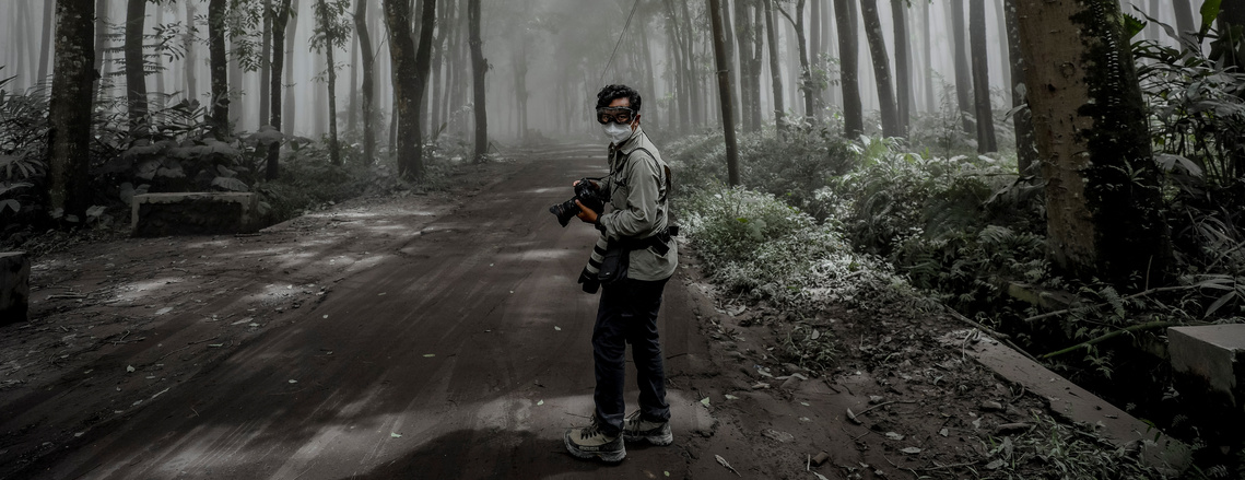 Mas Agung Wilis Yudha Baskoro was seen on assignment during Mount Semeru eruption in East Java (2021)