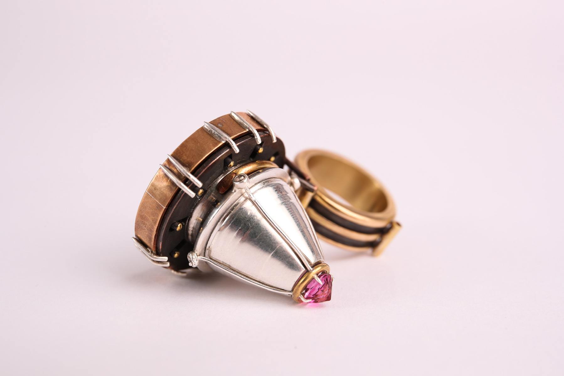 Step 6: Conquer

Silver, lathed wax casted in silver, brass, copper, enamel, glass stone.
1.5’’x2.25’’x1.5’’
2018

** Aperture is fully functional and can open and close to reveal the enameled inner cone and back set stone. 