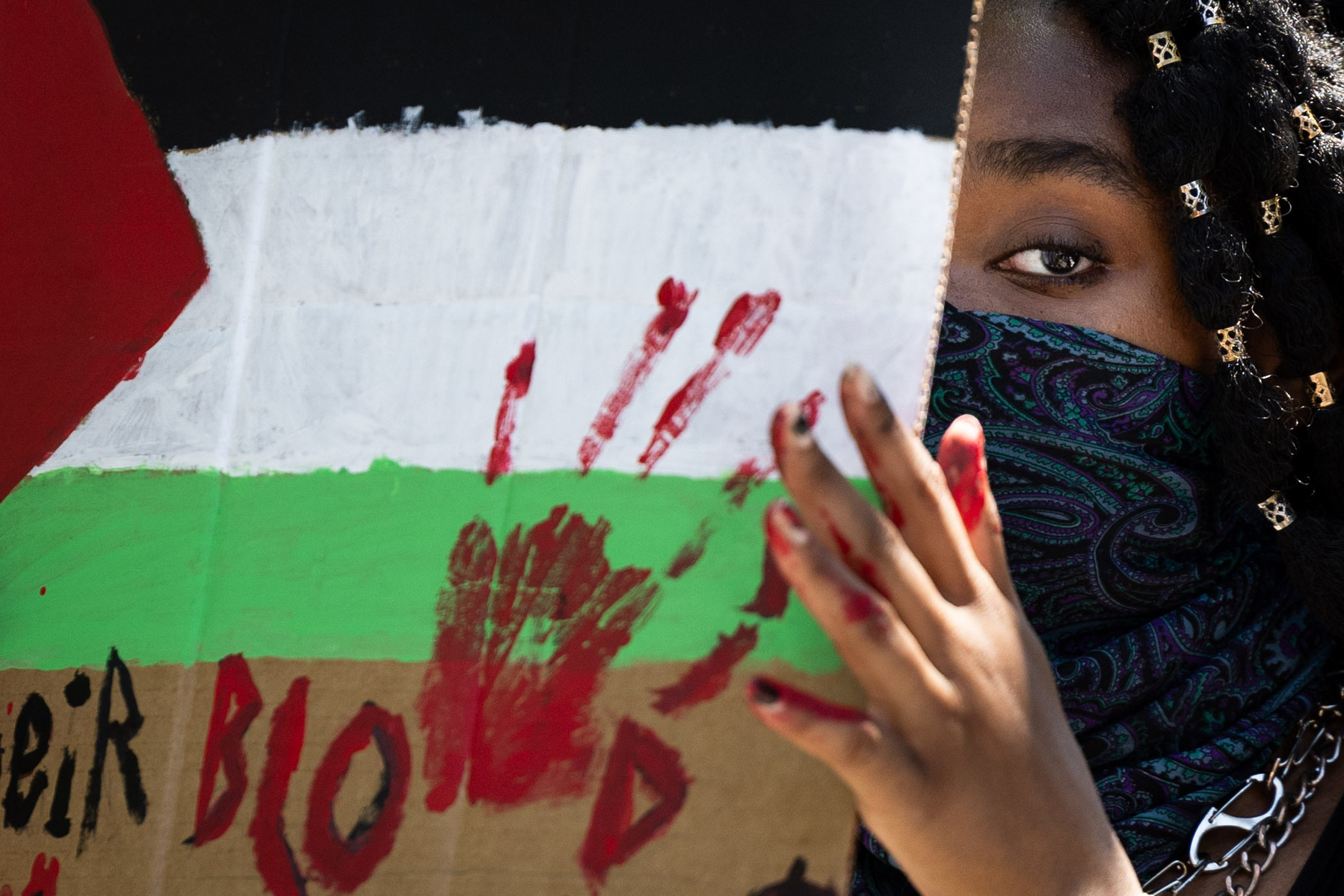 VCU student Ashc (sic) holds up a sign during a pro-Palestine demonstration on VCU’s campus in Richmond, Va., Monday, April 29, 2024.