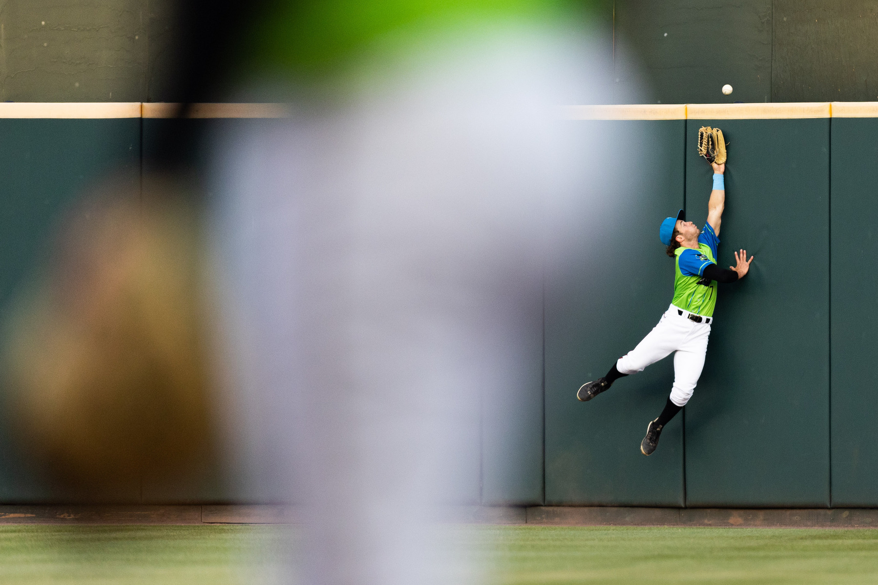 Flying Squirrels catcher Brett Auerbach tries to catch a ball during a baseball game against the Erie SeaWolves at The Diamond in Richmond, Va., on Friday, April 21, 2023.
