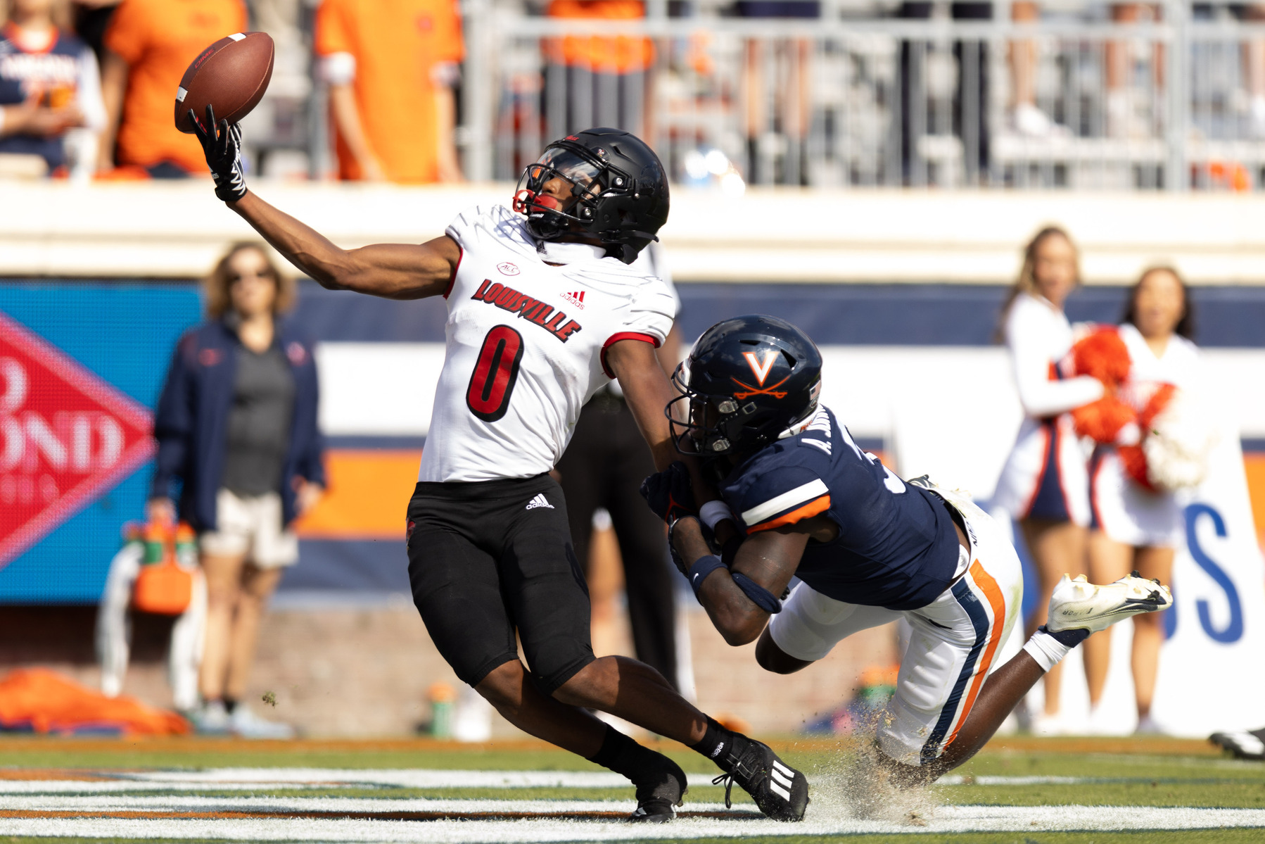 Louisville's Tyler Hudson attemps to catch the ball in the endzone during a game against Virginia in Charlottesville, Va on Saturday, Oct. 8, 2022. (Mike Kropf/The Daily Progress)