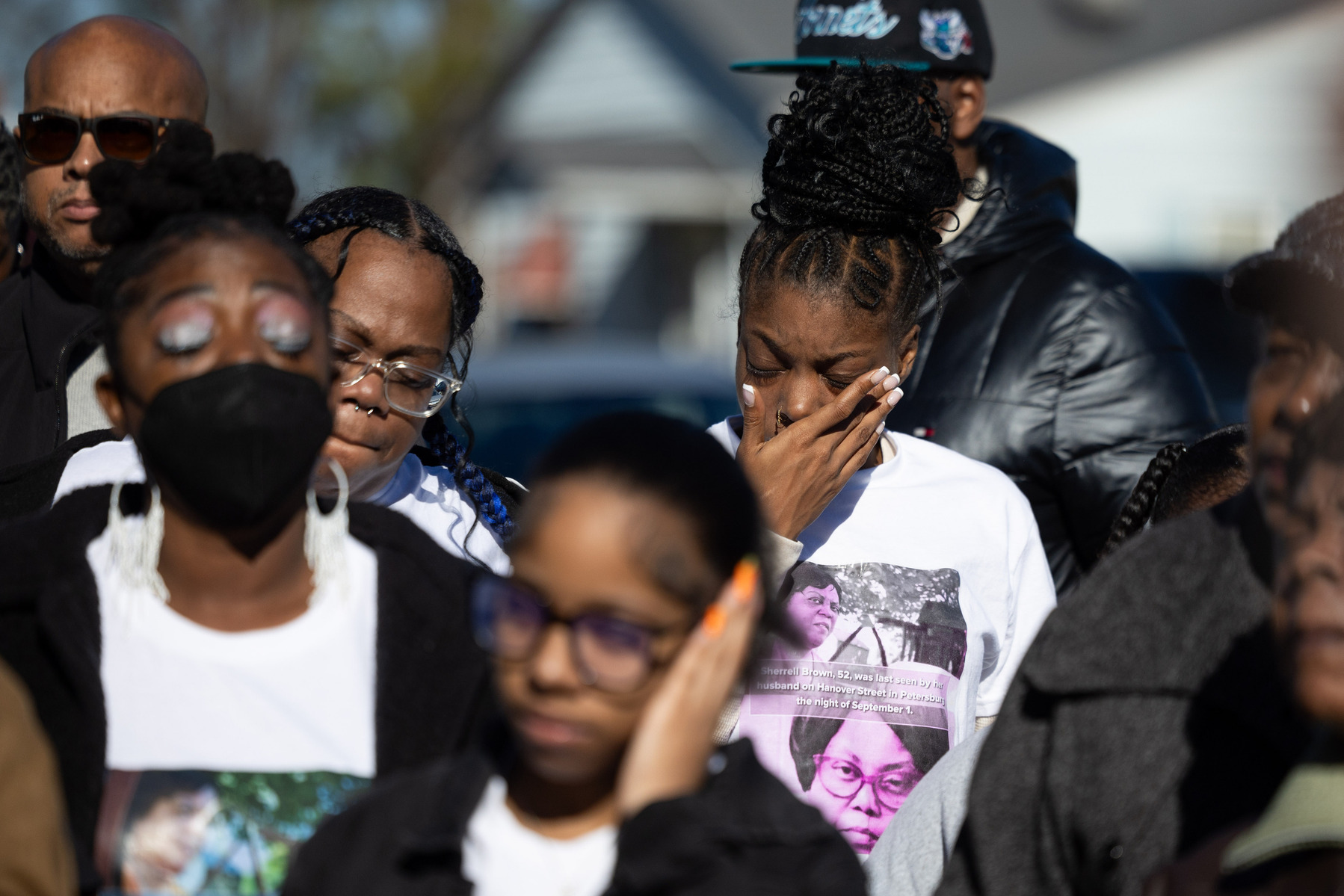 Friends and family members of Sherrell Brown, who has been missing for over three months, attend a news conference outside of her home in Petersburg, Va., Friday, Dec. 15, 2023.