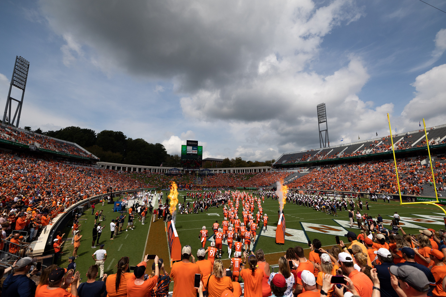 The University of Virginia football team runs out on the field at Scott Stadium before a game against the University of Richmond in Charlottesville, Va., on Saturday, Sept. 3, 2022.