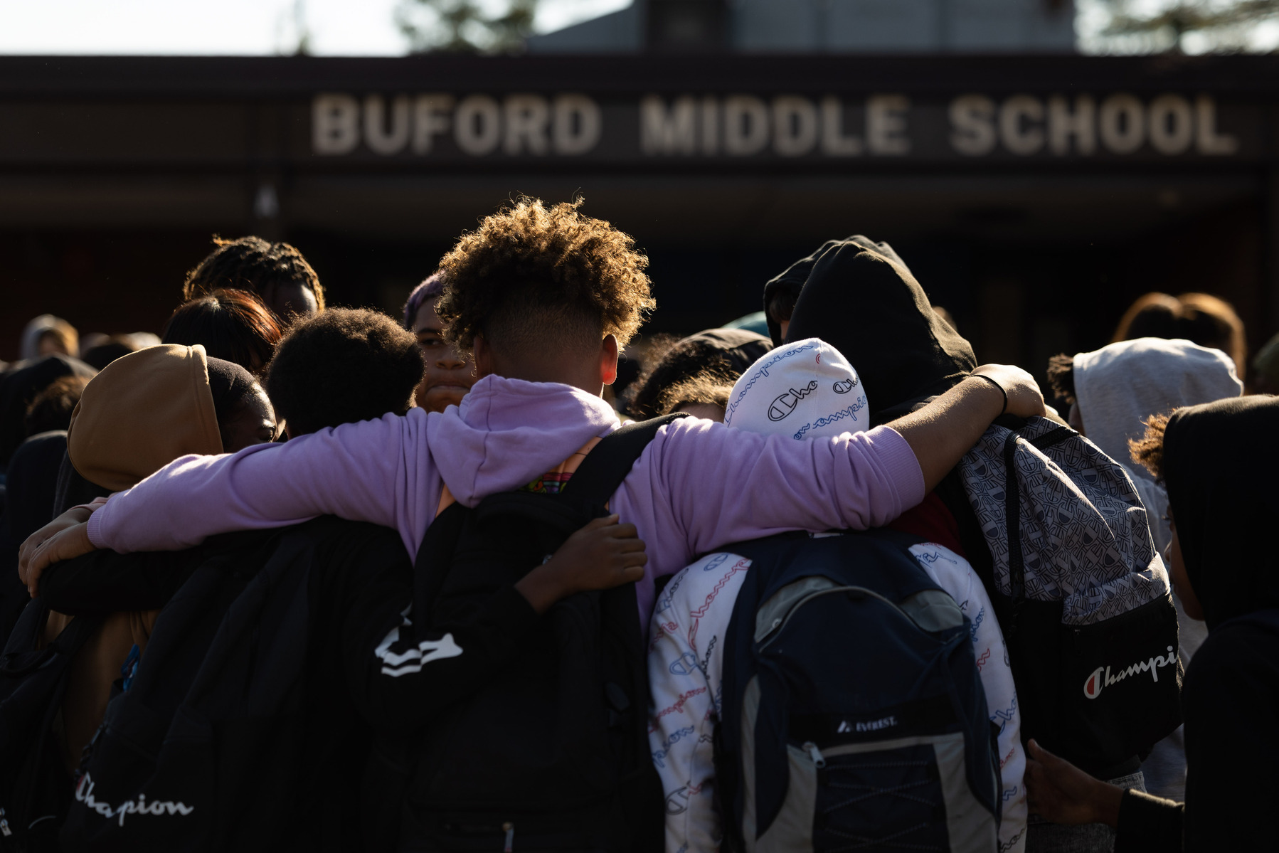 A group of students hugs during a walk out at Buford Middle School against gun violence following the shooting deaths of three students at UVa. Charlottesville, Va., Friday, Nov. 18, 2022.
