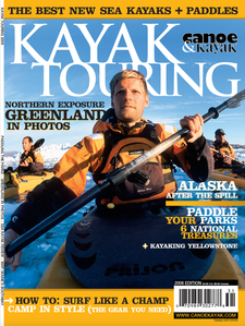 Publication tearsheet of a magazine cover showing a kayaker paddling with his team on a sea full of growlers in Greenland.