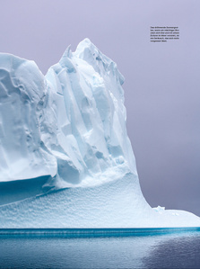 Publication tearsheet of a huge iceberg wall lit by the midnight sun in north Greenland.