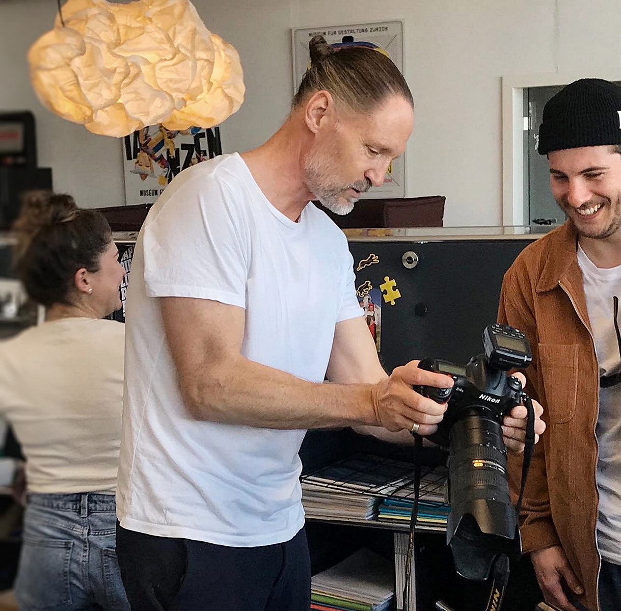 Professional and corporate photographer showing is work on the display of his camera on a photo shoot in Zurich, Switzerland.