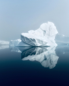Iceberg surrounded by of in Greenland – Stand up paddling adventure.