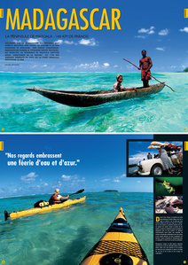 Publication tearsheet showing two sea kayakers paddling in the lagoon along the Masoala Peninsula in Madagascar.