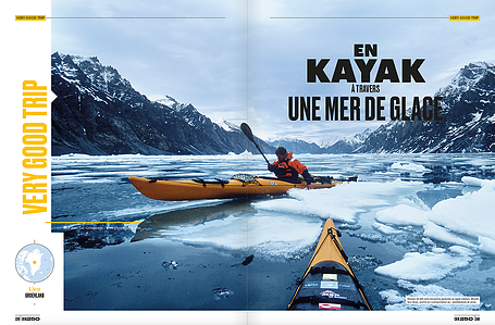 Publication tearsheet of a spread page showing a kayaker searching his way through a sea full of ice growlers in Greenland.