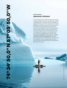 Publication tearsheet of a stand up paddler paddling in front of  a huge iceberg in north Greenland.