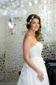 Portrait of the bride in standing in beauty salon.