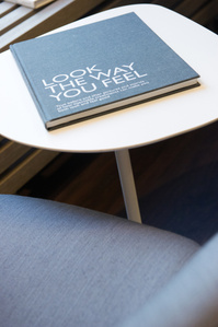 Detail of a book lying on a coffee table.