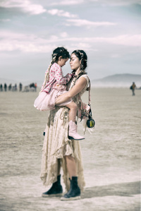 Portrait of a mother and her child at the Burning Man event at Black Rock city.