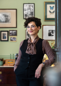 Lifestyle photograph of owner posing in his  barbershop in Switzerland.