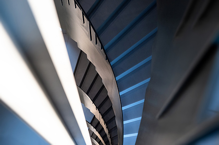Interior photography of stairway with dynamic perspective.
